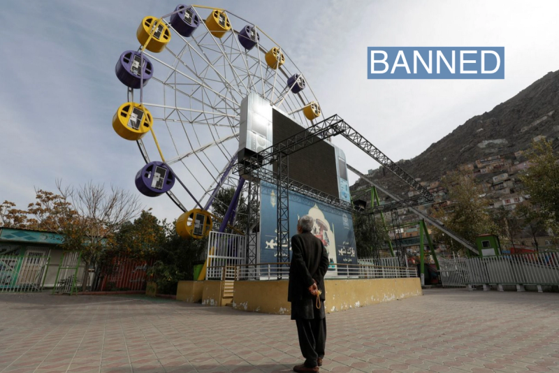 An Afghan man stands in an amusement park in Kabul, Afghanistan, November 9, 2022. 