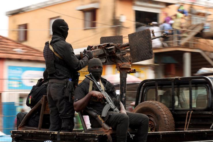 Soldiers patrol on the main road in Bissau.