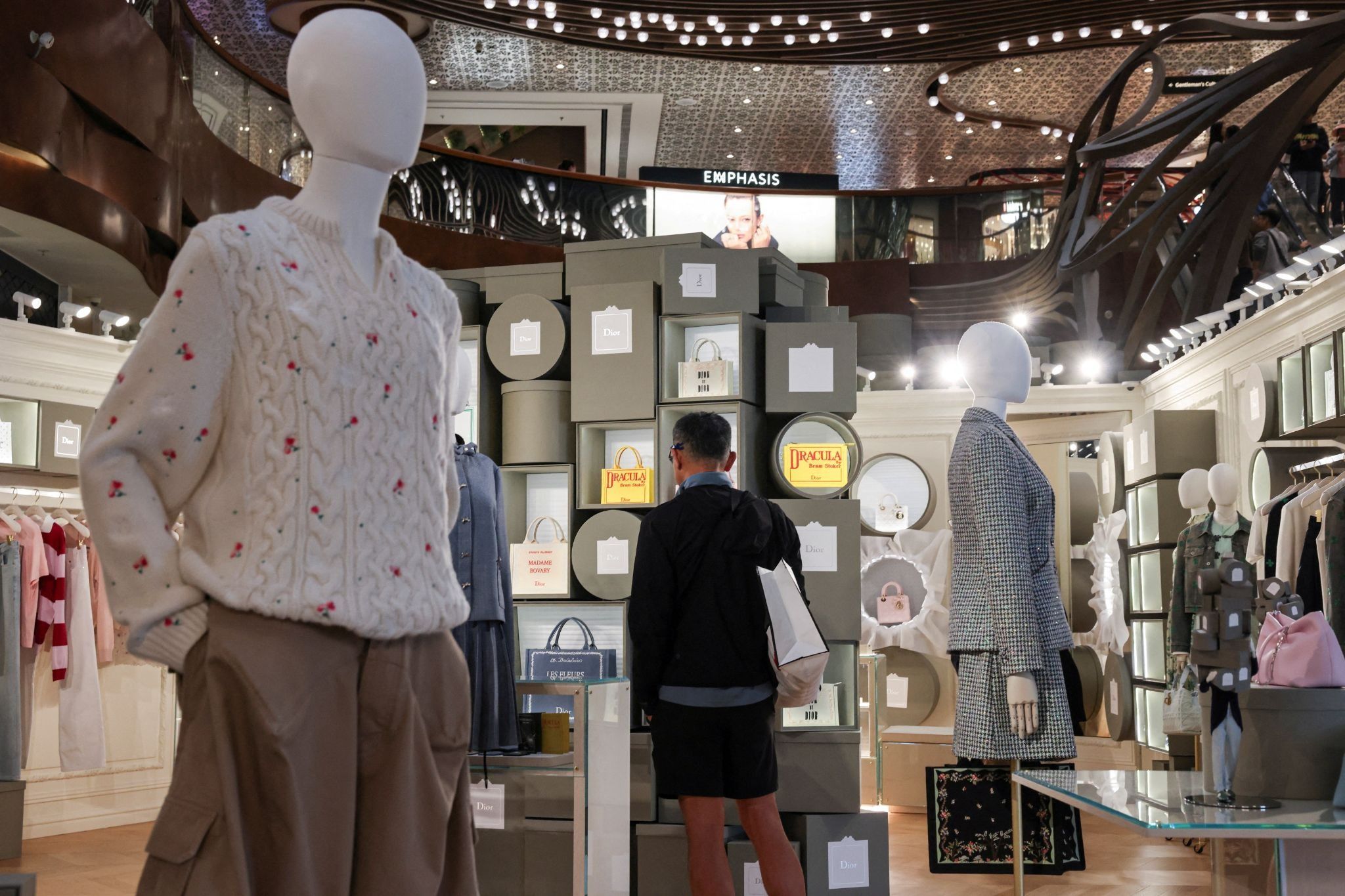 A customer looks at products inside a Dior store in K11 MUSEA in Hong Kong