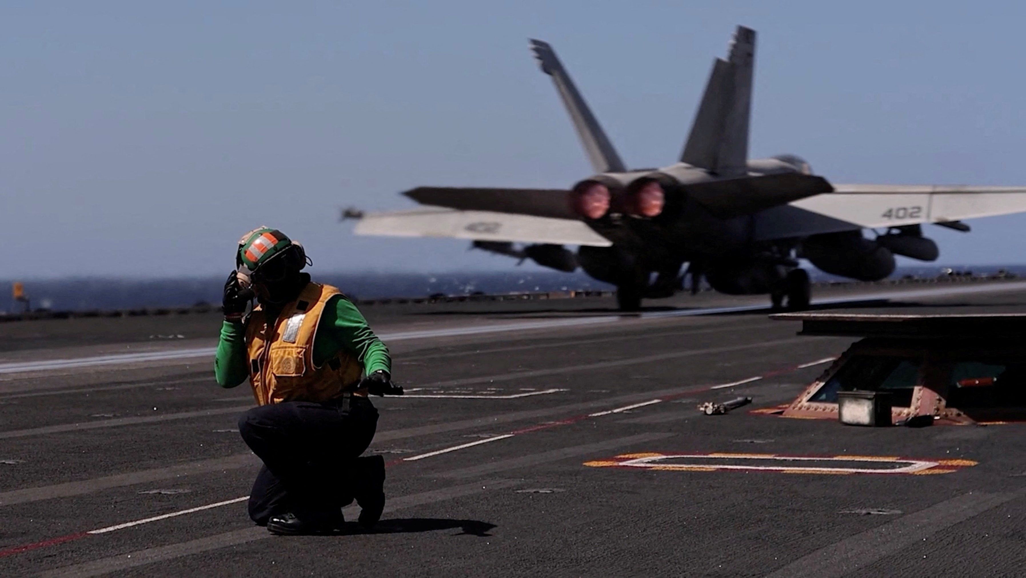 A US jet takes off from an aircraft carrier during “Operation Epic Fury”