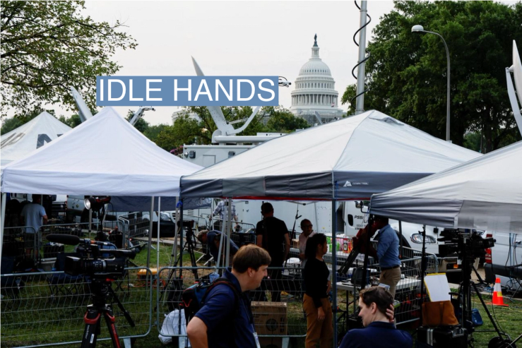 Media members prepare for the eventual arrival of former U.S. President Donald Trump, who is facing federal charges in connection with attempts to overturn his 2020 election defeat, at U.S. District Court in Washington, U.S., August 3, 2023.