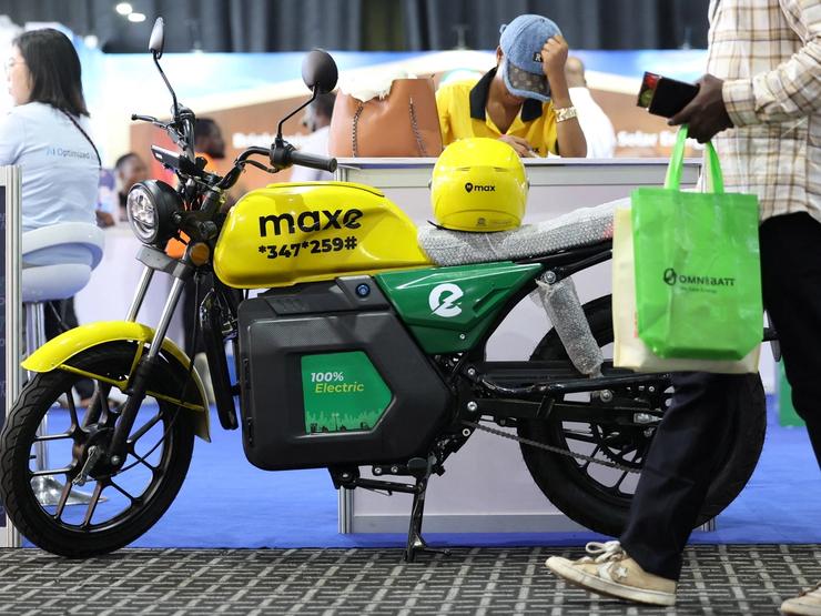 A person walks past an electric bike during an electric autos exhibition in Lagos.