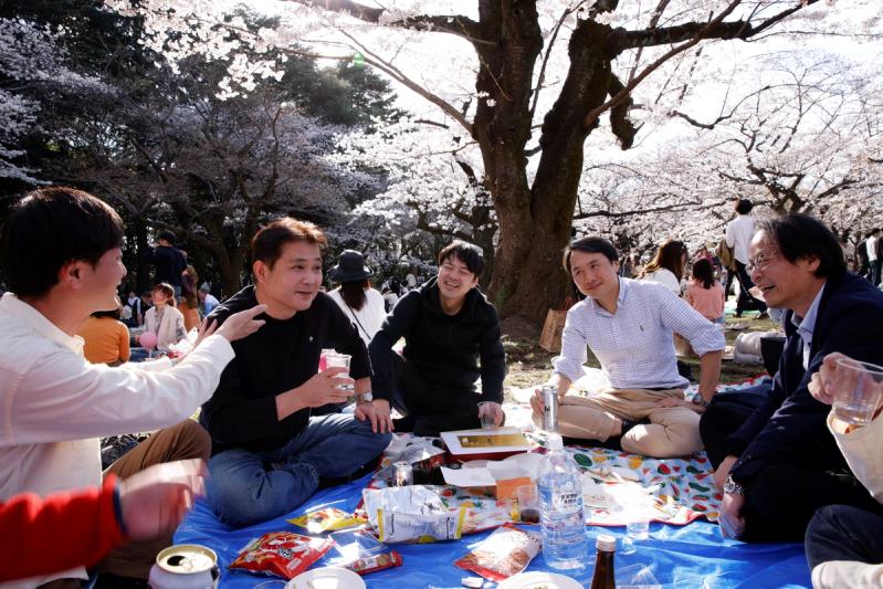 People enjoy a cherry blossoms party, in Tokyo, Japan, March 20, 2023. REUTERS/Androniki Christodoulou