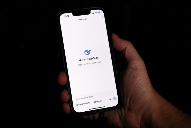 A mobile phone displays the DeepSeek AI assistant app