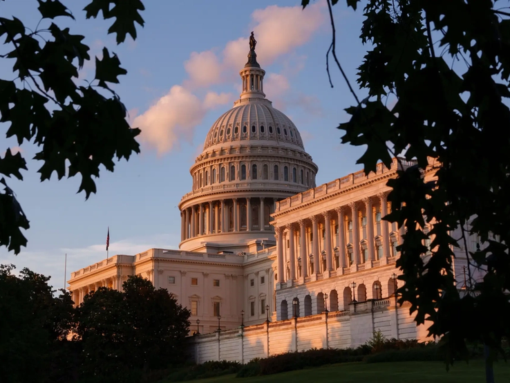 The US Capitol at sunset.