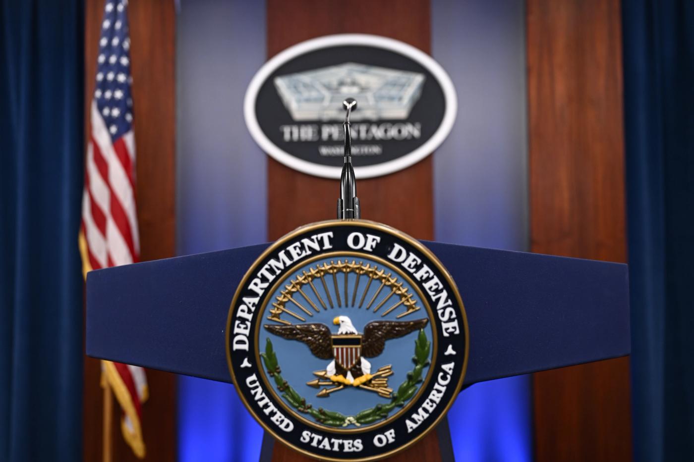 Department of Defense and Pentagon logos are seen ahead of a press conference at the Pentagon in Washington D.C.