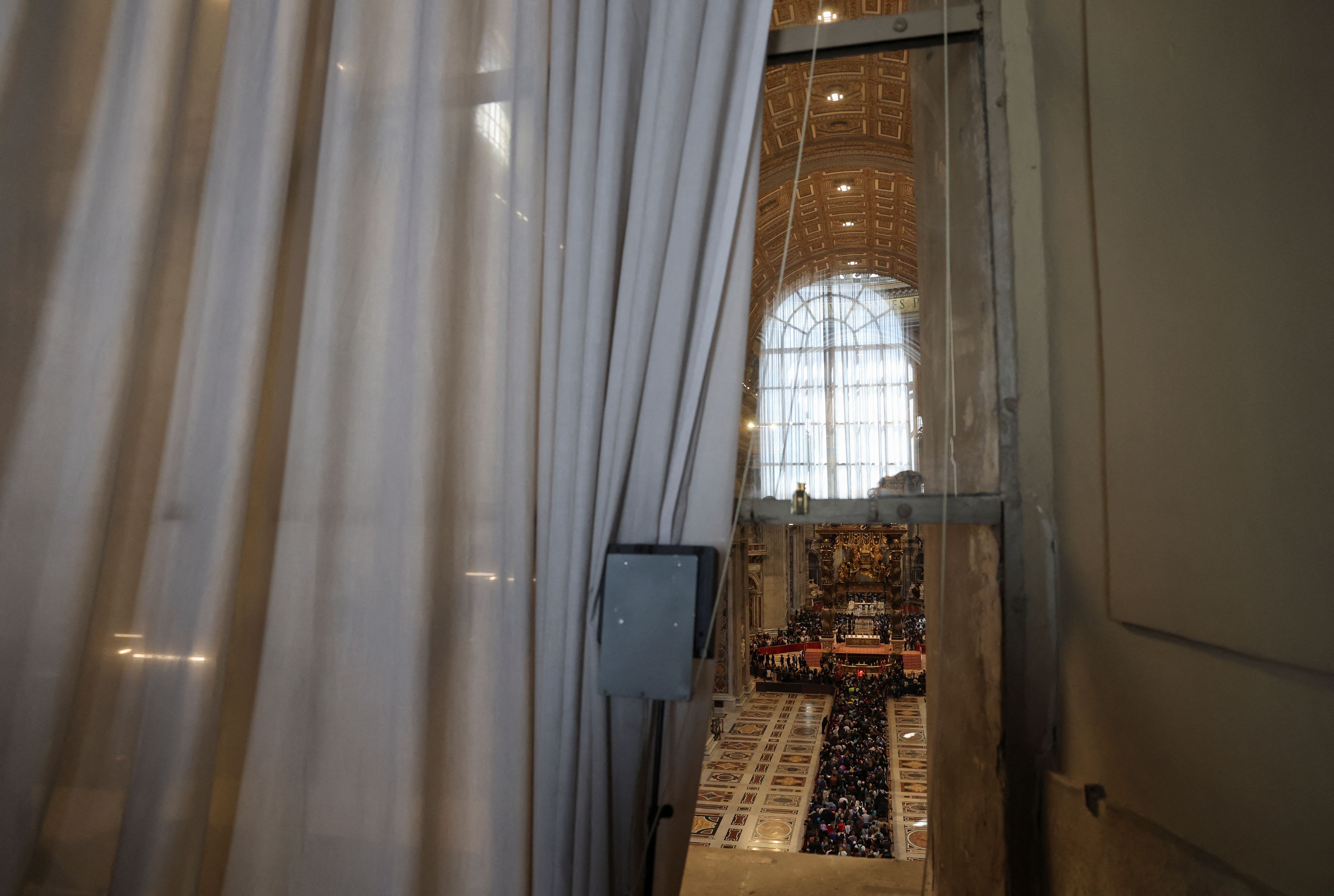 A view shows a reflection of a Loggia delle Benedizioni (Loggia of Blessings) balcony door where new popes are announced following conclaves. 