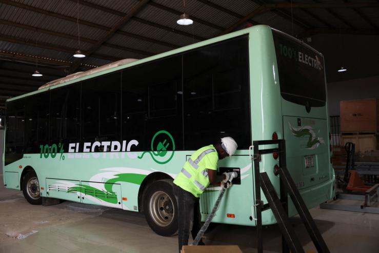 An engineer charges an electric bus in Lagos, Nigeria.