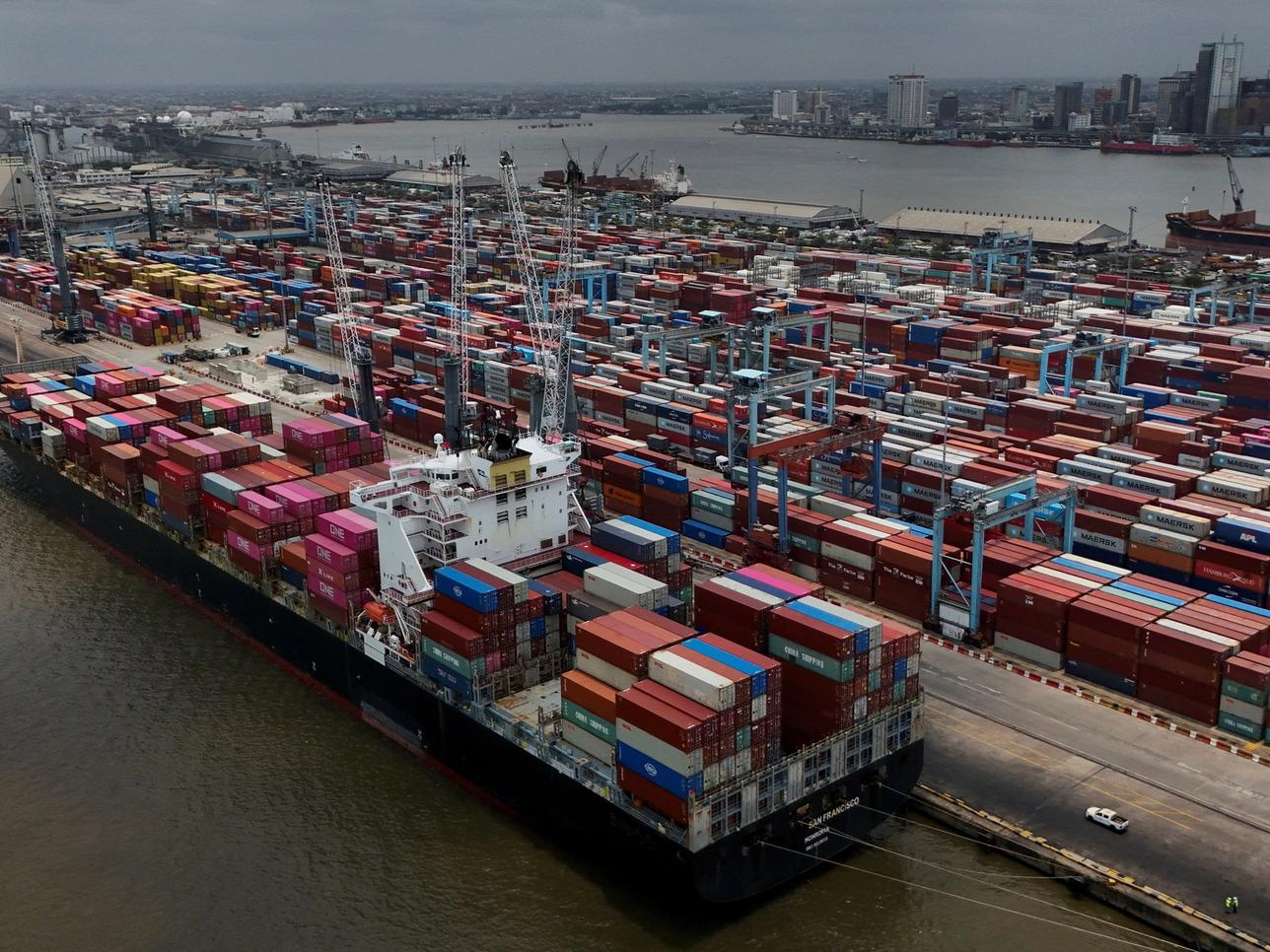 A container ship prepares to offload cargo in Nigeria.