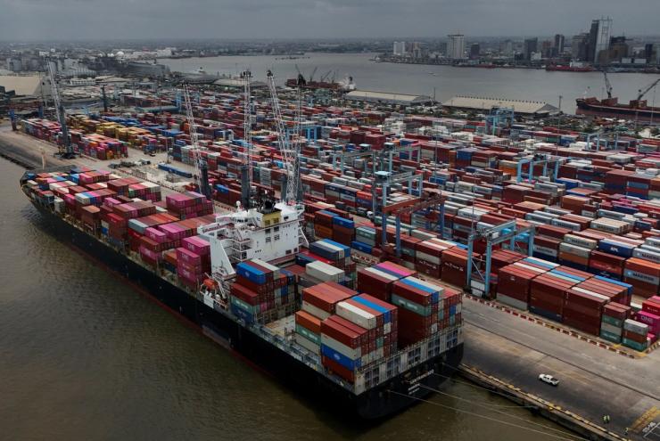 A container ship prepares to offload cargo in Nigeria.