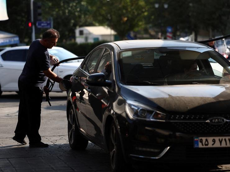 A man at a gas station in Tehran, Iran
