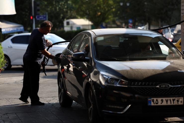 A man at a gas station in Tehran, Iran