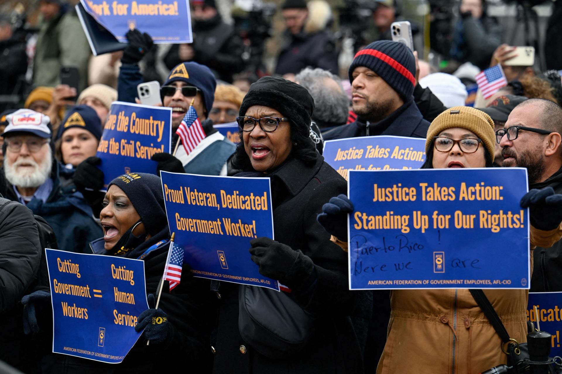 Labor union activists rally in support of federal workers during a protest on Capitol Hill in February. 