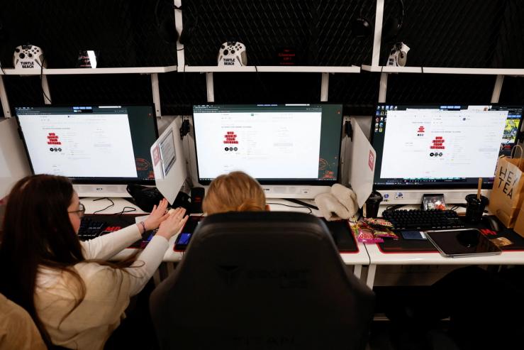 Fans of K-POP boy band BTS, known as ARMY, sit in front of screens as they wait for ticketing to open for BTS’s first South Korea concerts in years as part of the world tour, at a PC cafe in Seoul, South Korea.