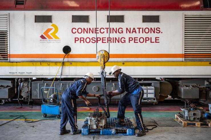 Maintenance workers check locomotive parts in the repair workshop of the Mombasa-Nairobi Railway in Nairobi, Kenya.
