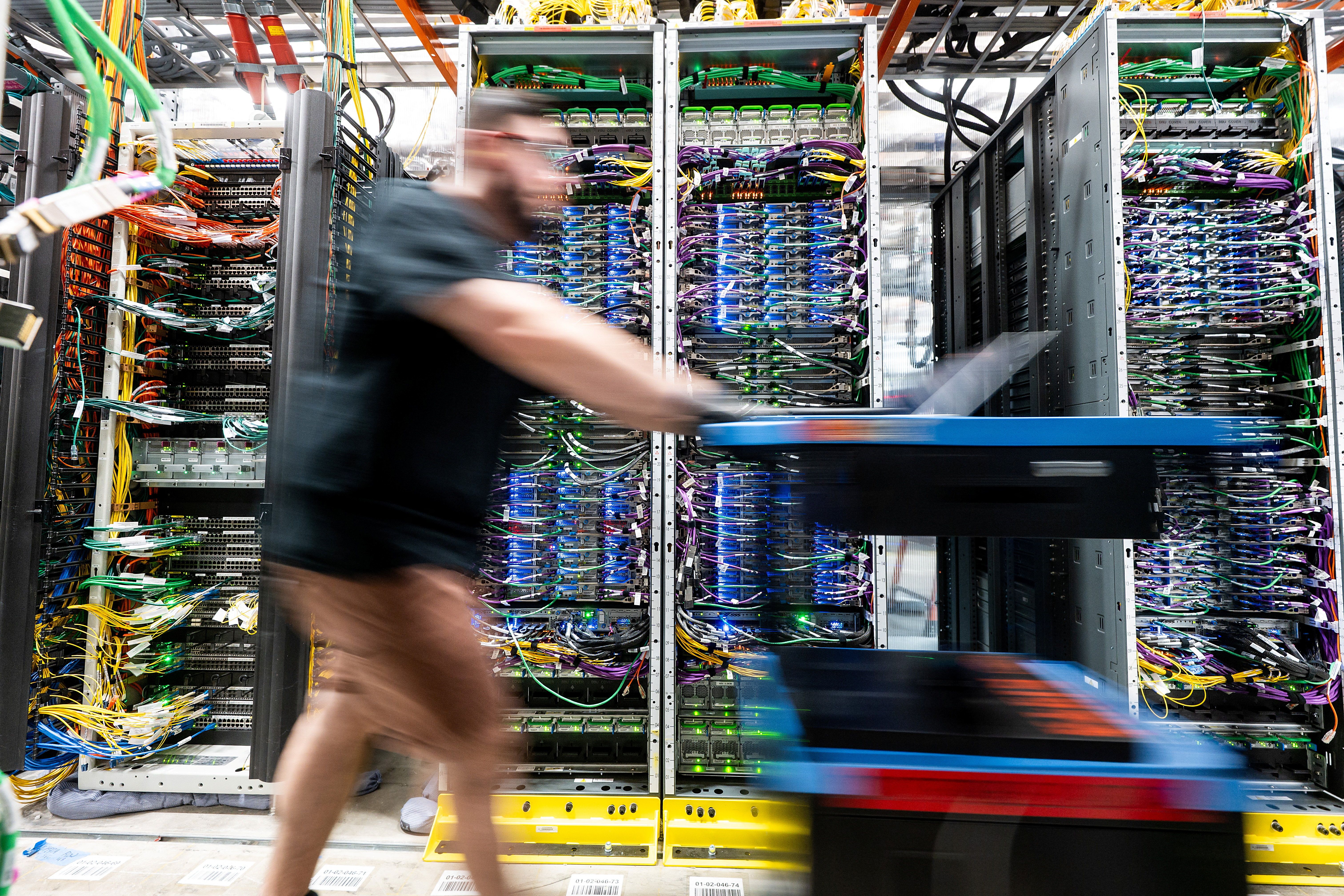 A technician works at an Amazon Web Services data center 