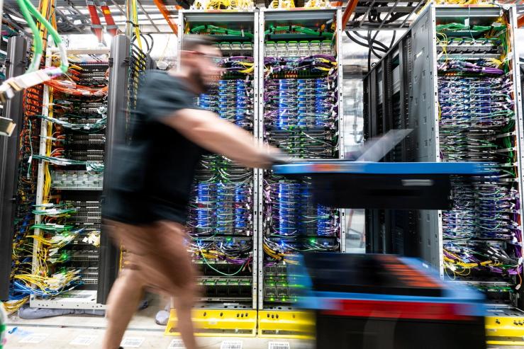 A technician works at an Amazon Web Services data center