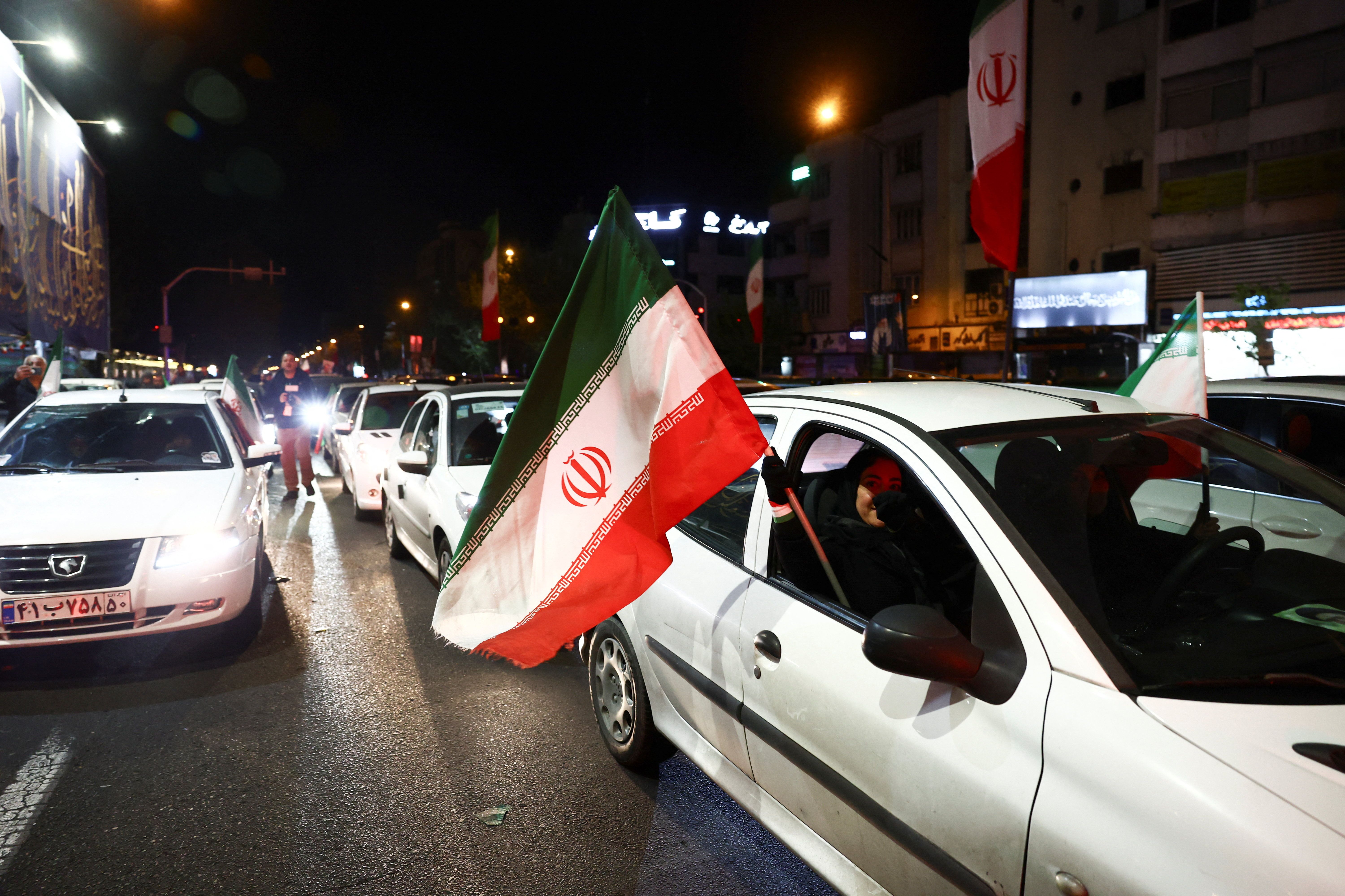 People gather after a two-week ceasefire in the Iran war was announced, in Tehran