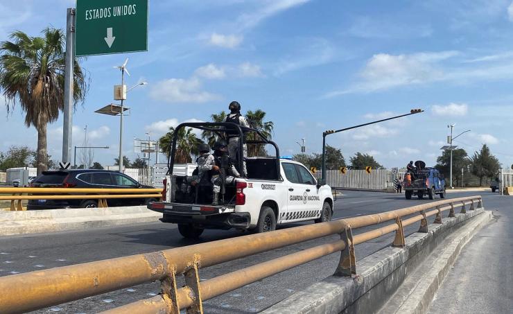 Members of the National Guard escort ambulances carrying the two American kidnapping survivors in Matamoros, Mexico on March 7, 2023.