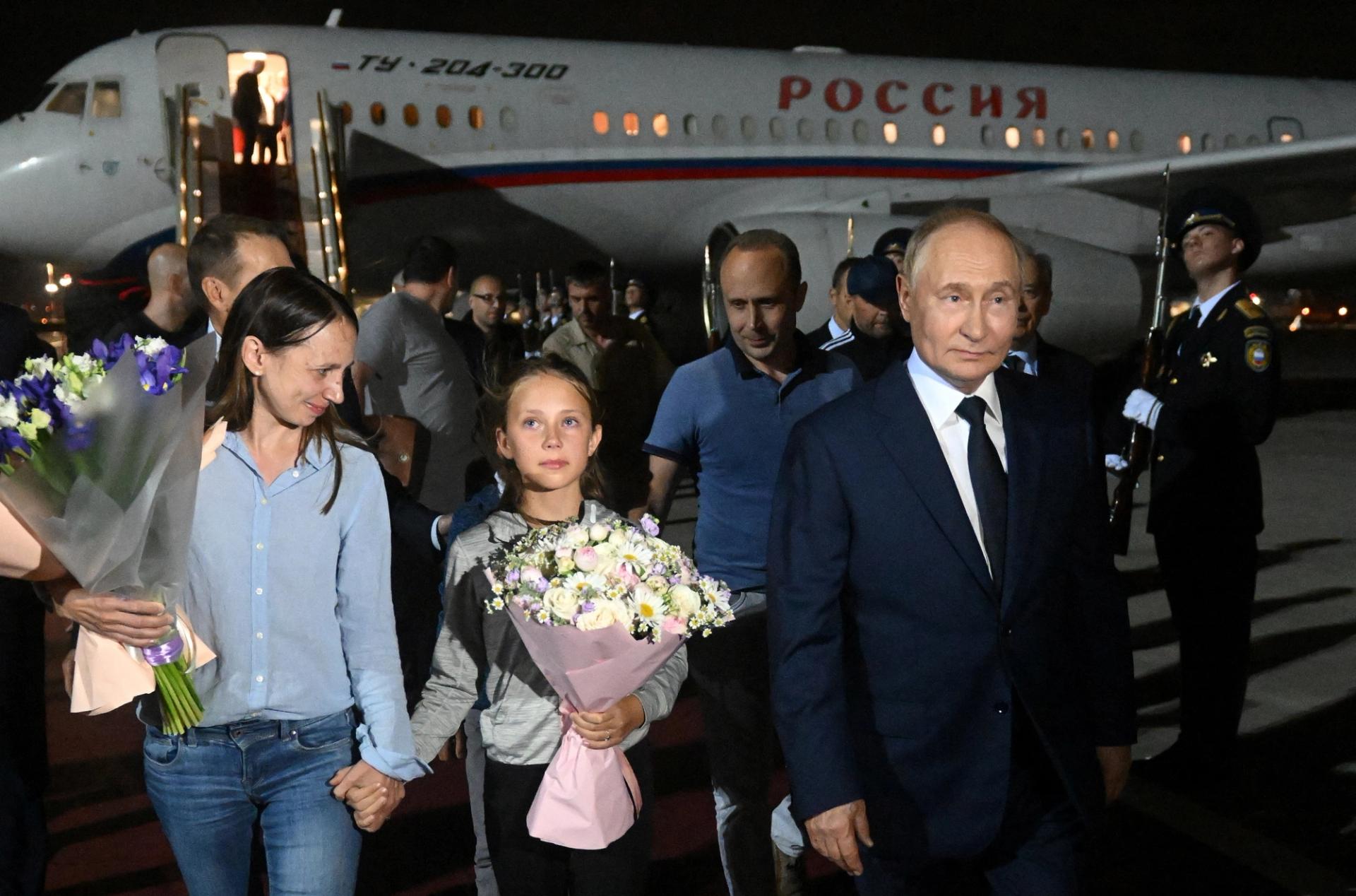 Russian President Vladimir Putin welcomes Russian nationals, including Artyom Dultsev, Anna Dultseva and their children, following a prisoner exchange between Russia with Western countries on Aug. 1, 2024.