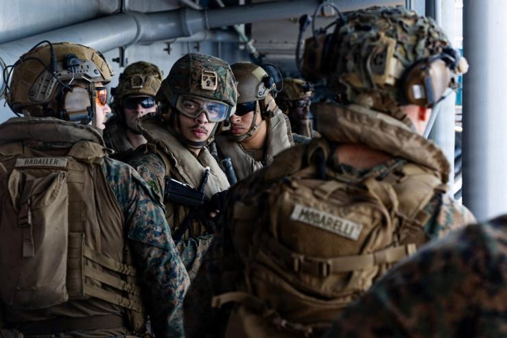 US Marines engage in a live-fire exercise on the USS Tripoli