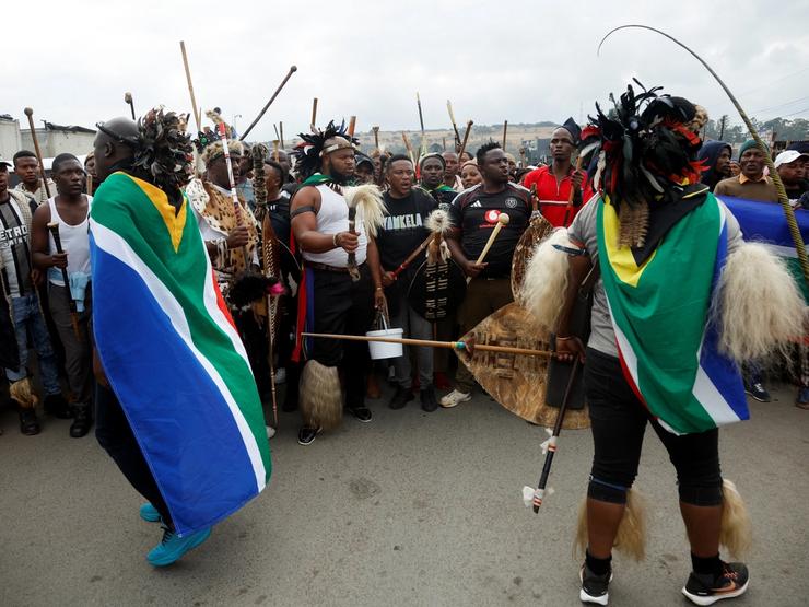 Supporters of the South African anti-immigrant group ‘March and March’ hold a demonstration.