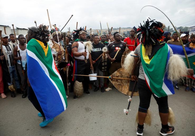 Supporters of the South African anti-immigrant group ‘March and March’ hold a demonstration.