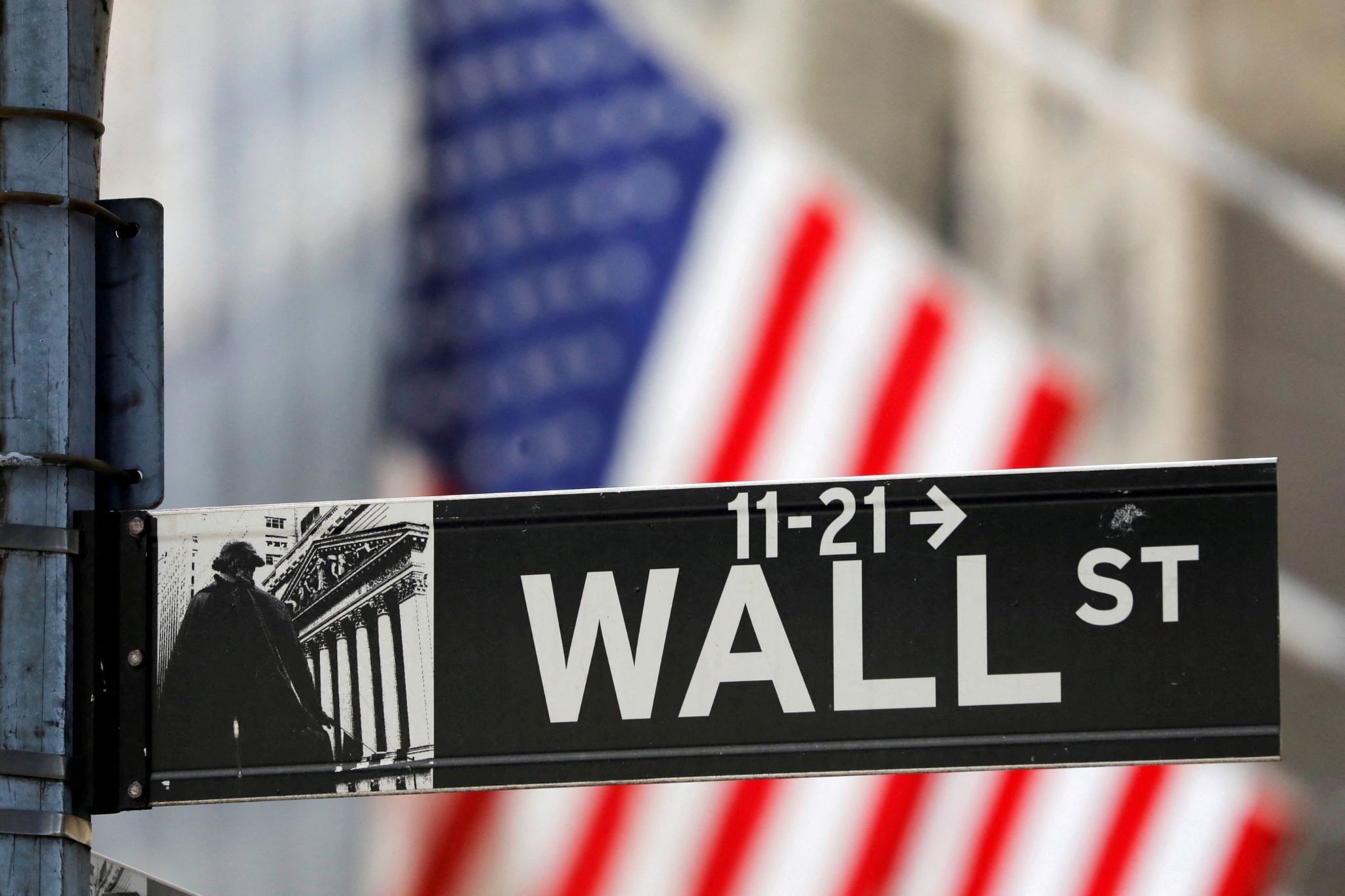 A street sign for Wall Street is seen outside the New York Stock Exchange (NYSE). 
