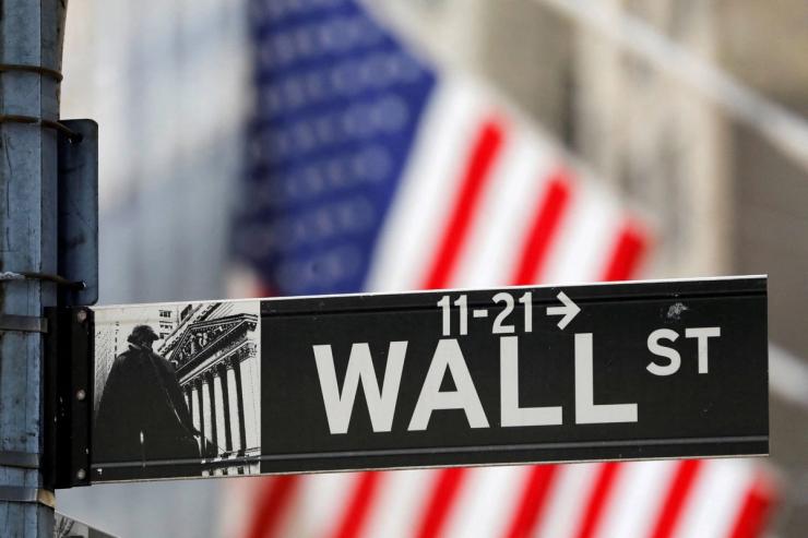 A street sign for Wall Street is seen outside the New York Stock Exchange (NYSE).