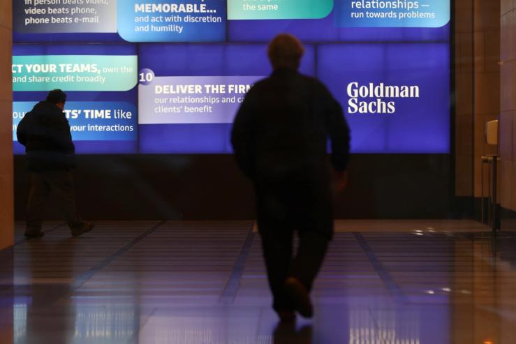 People walk in the Goldman Sachs global headquarters in Manhattan.
