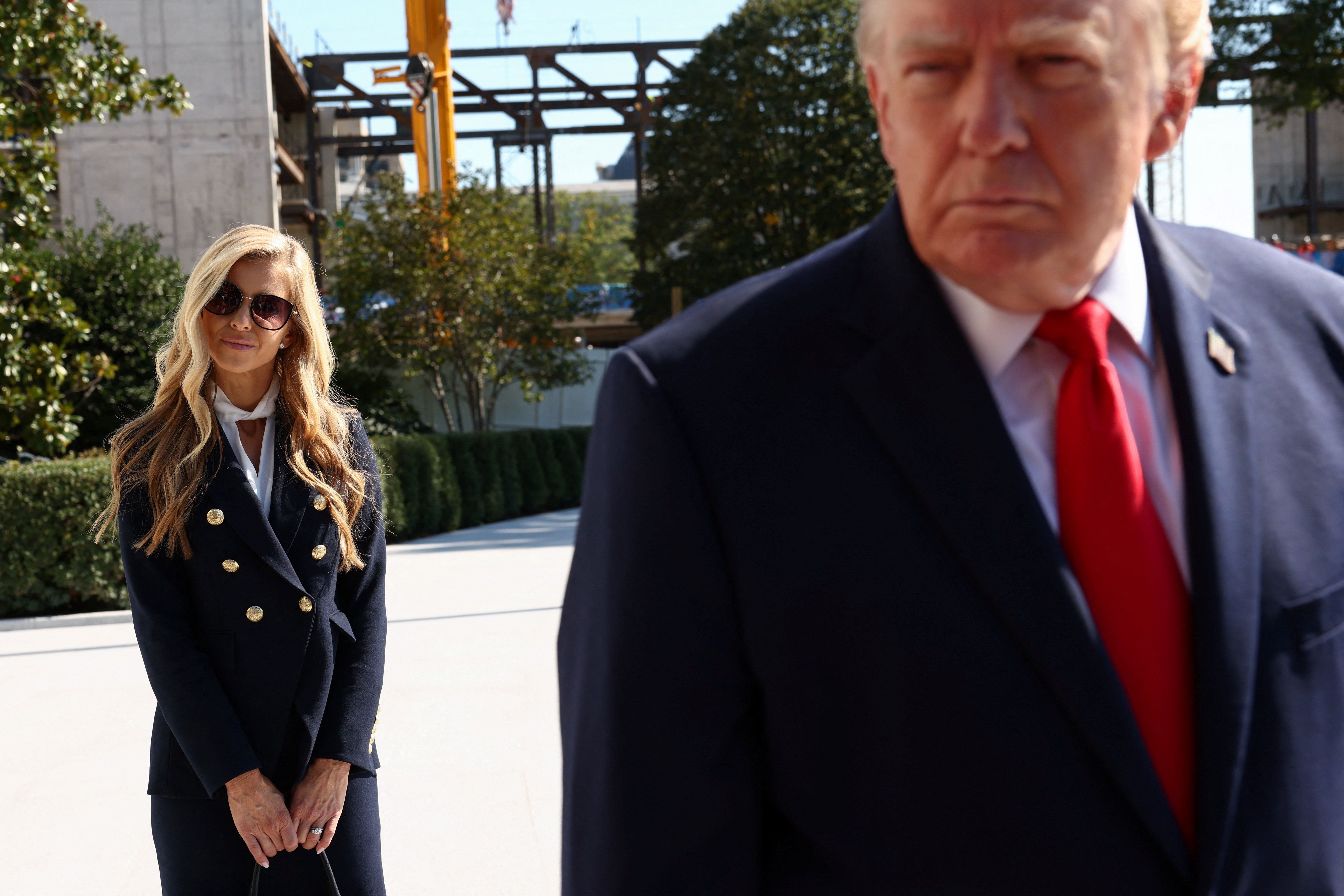New White House Press Secretary Katie Zacharia stands behind US President Donald Trump