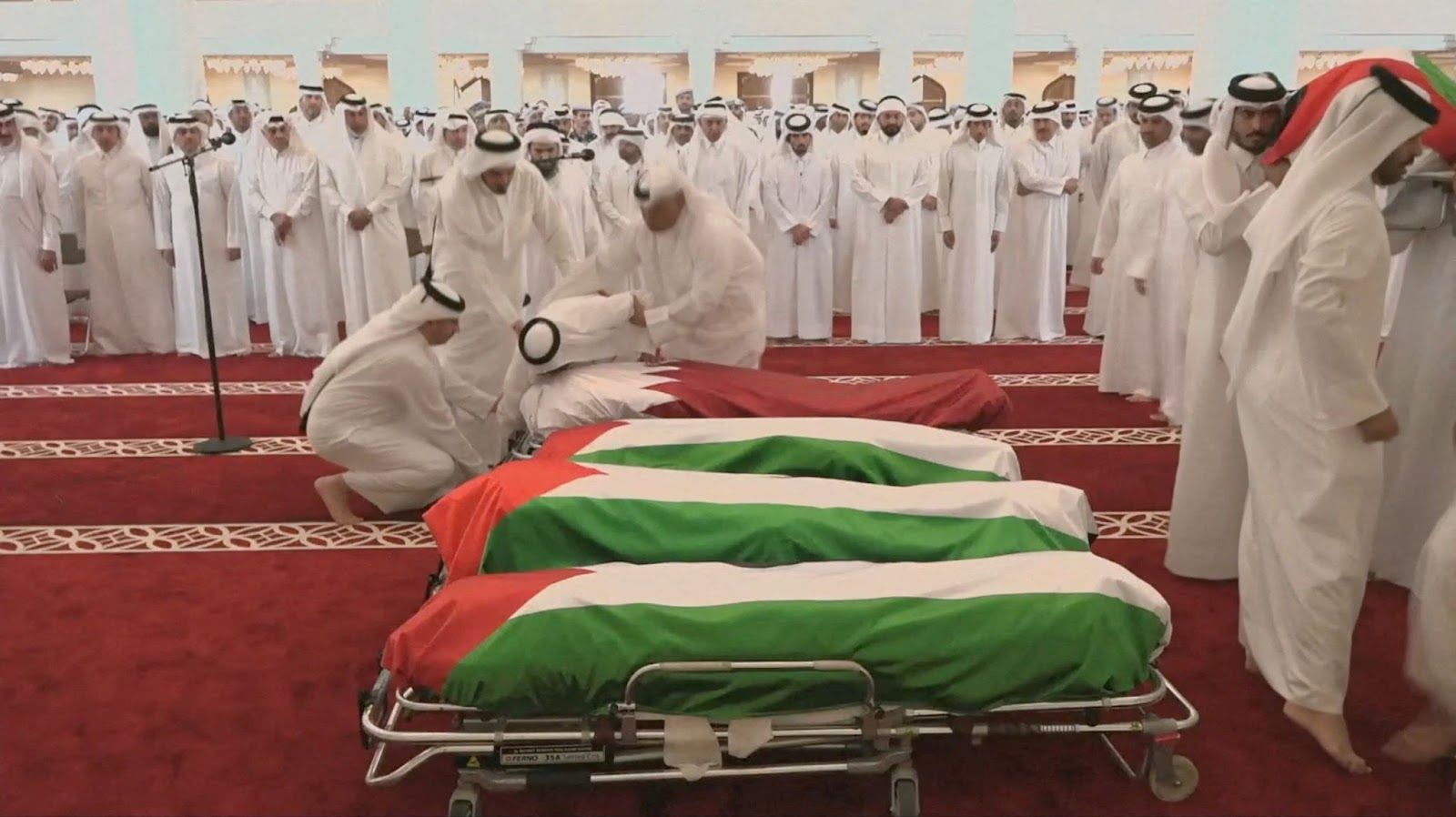 People attend a funeral held for those killed by an Israeli attack in Doha.