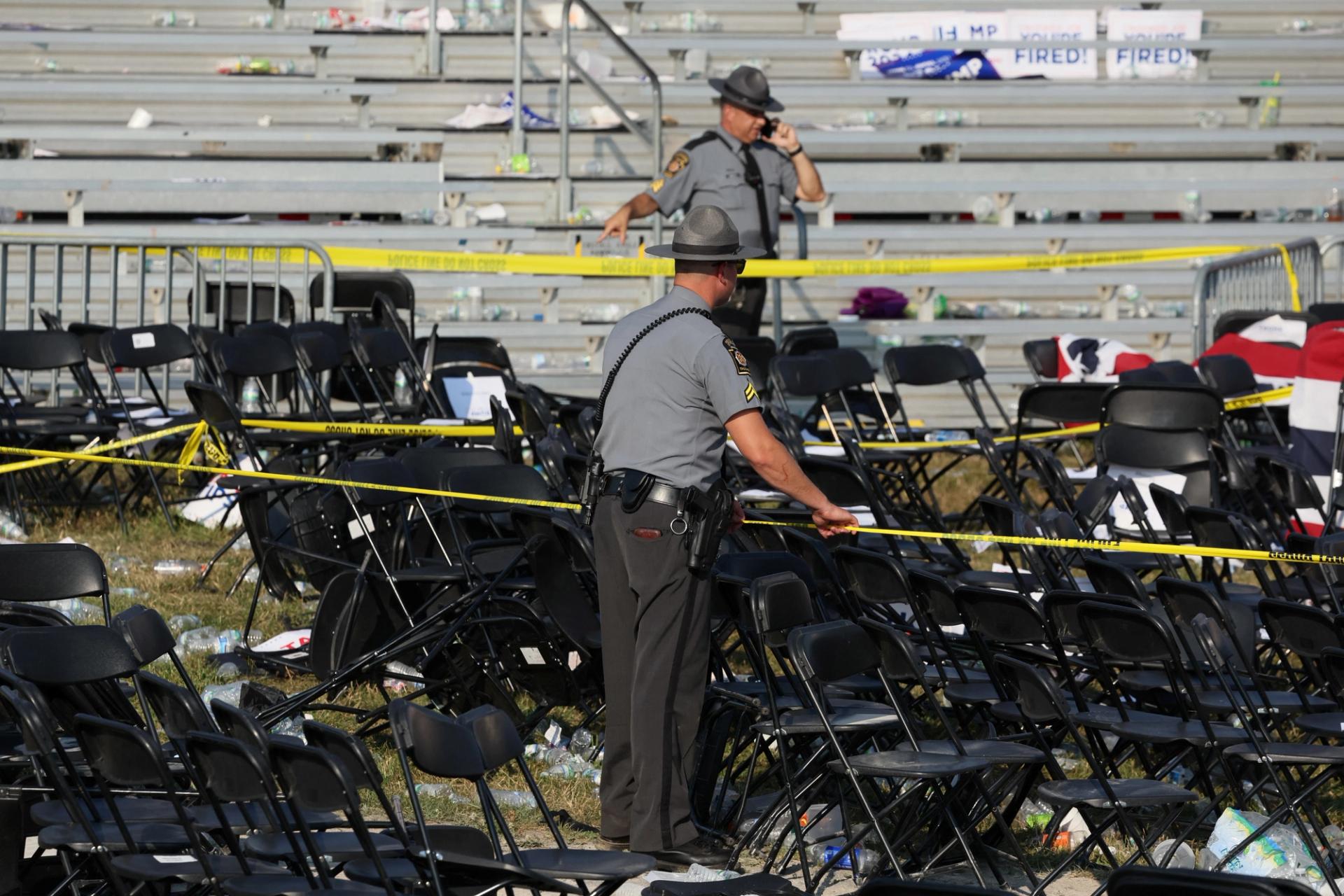 Security personnel put up barricade tape after multiple shots rung out at Republican presidential candidate and former U.S. President Donald Trump's campaign rally at the Butler Farm Show in Butler, Pennsylvania, U.S., July 13, 2024. 