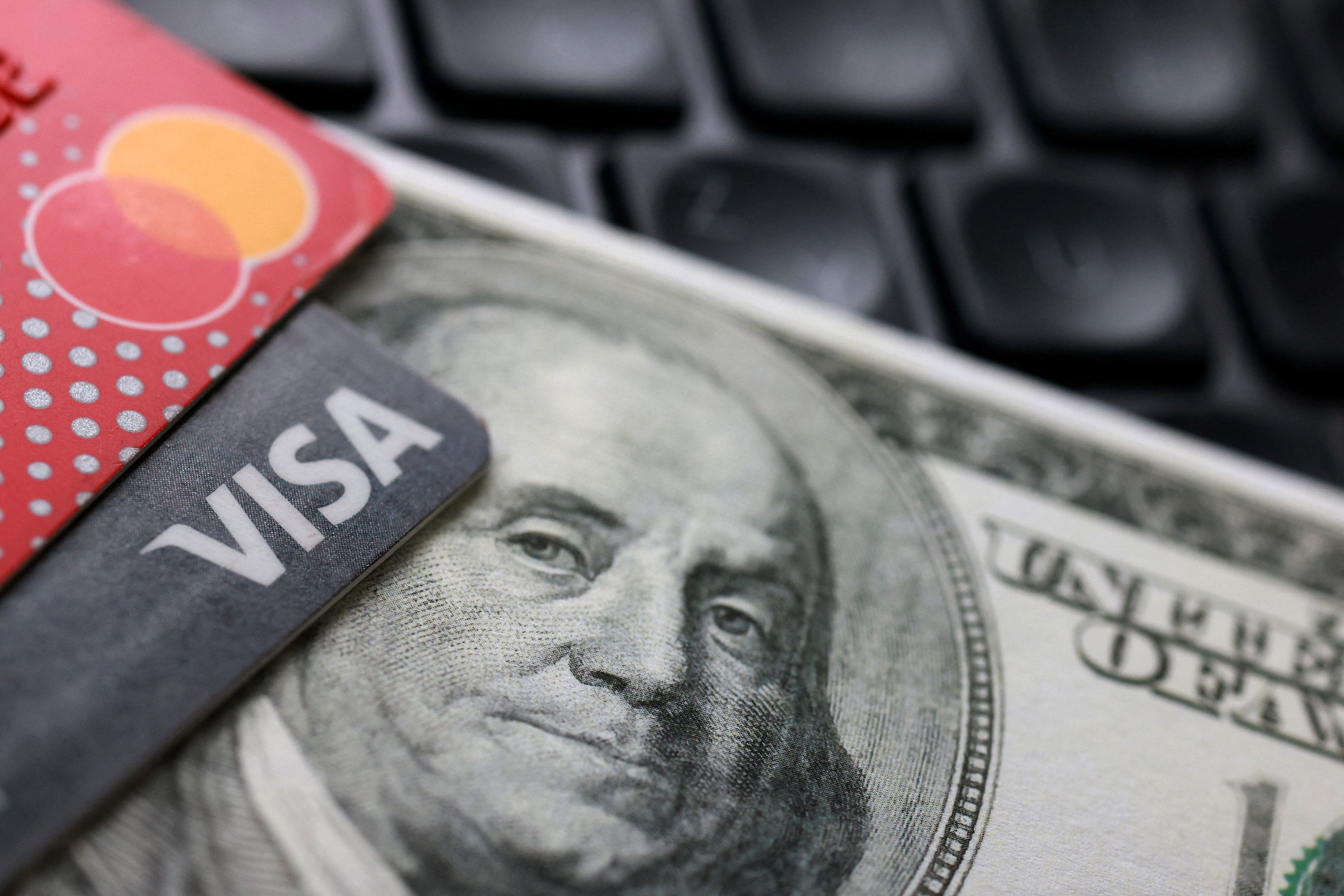 US dollar banknote, Visa and Mastercard cards.
