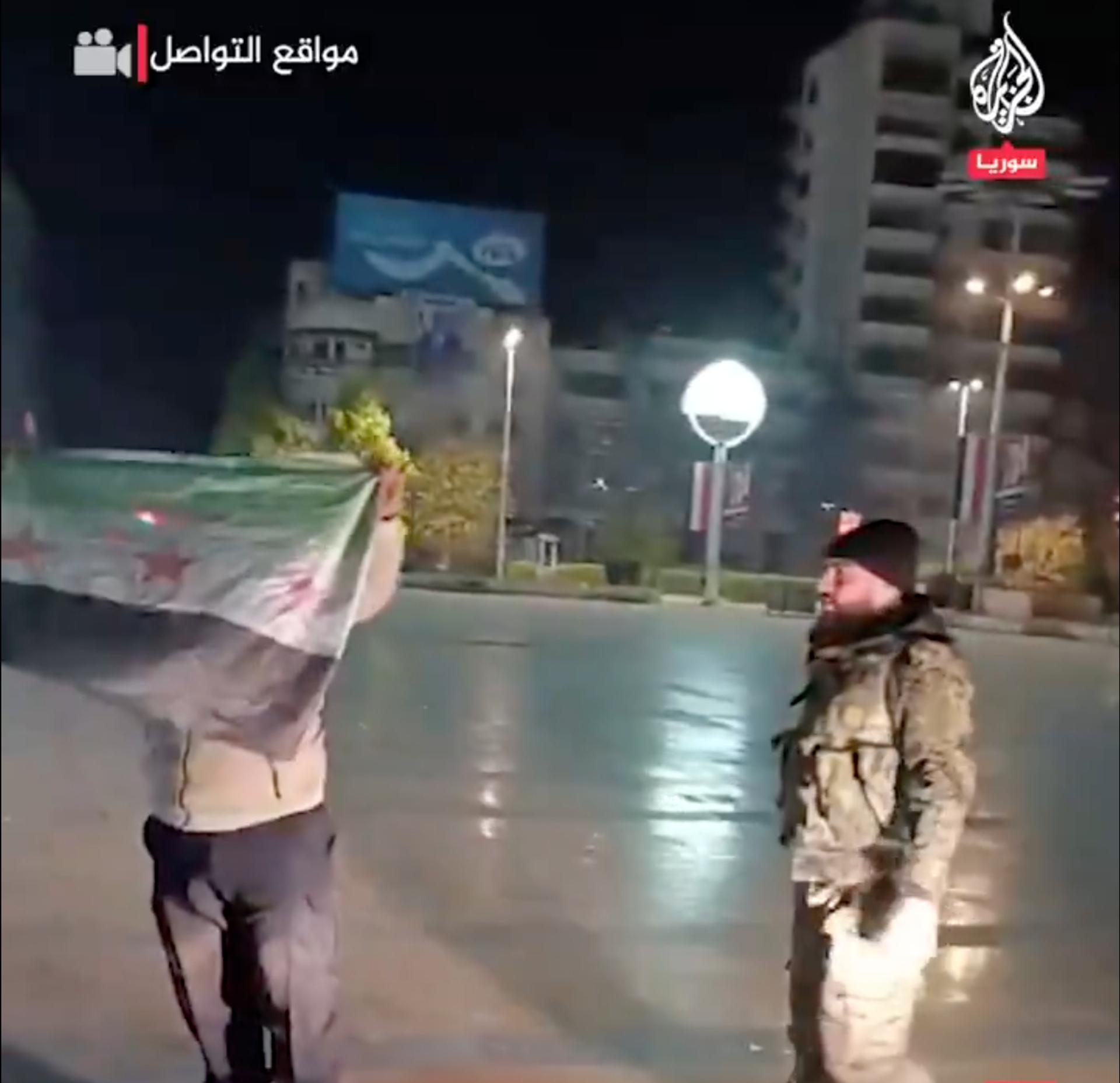 Syria’s rebel flag raised in Aleppo’s central square on Nov 29, 2024. 