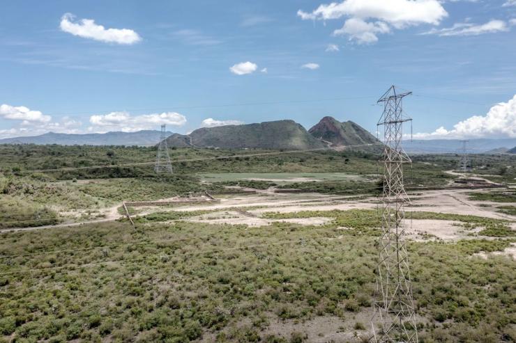 Electricity pylons supporting high-voltage transmission cables run through the Lake Elementaita National Wildlife Sanctuary in Kenya’s Great Rift Valley.