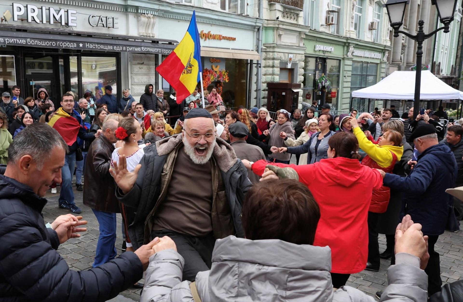 A voter celebrating in Moldova. 