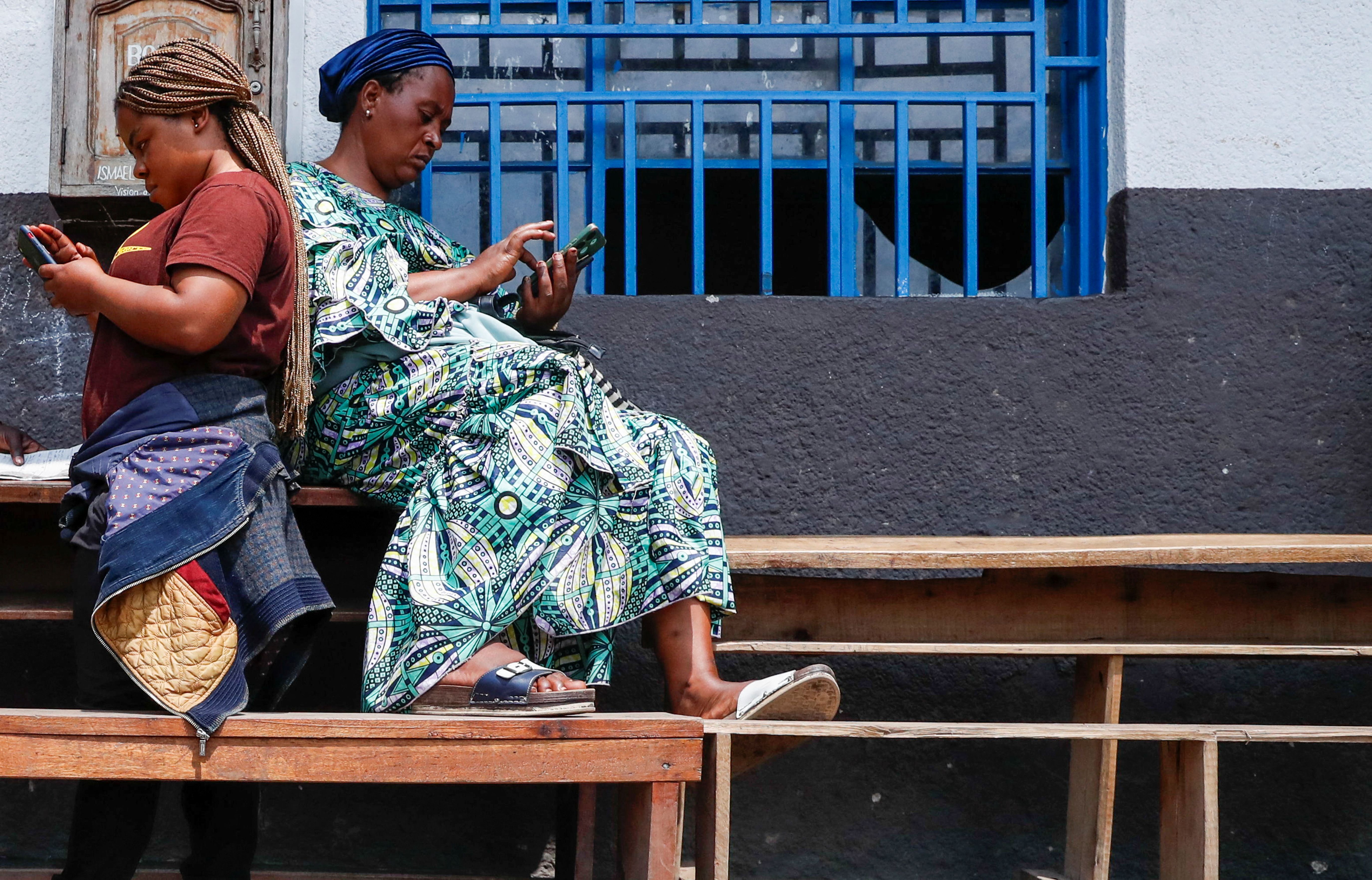 Women using their phones in Goma, DR Congo.