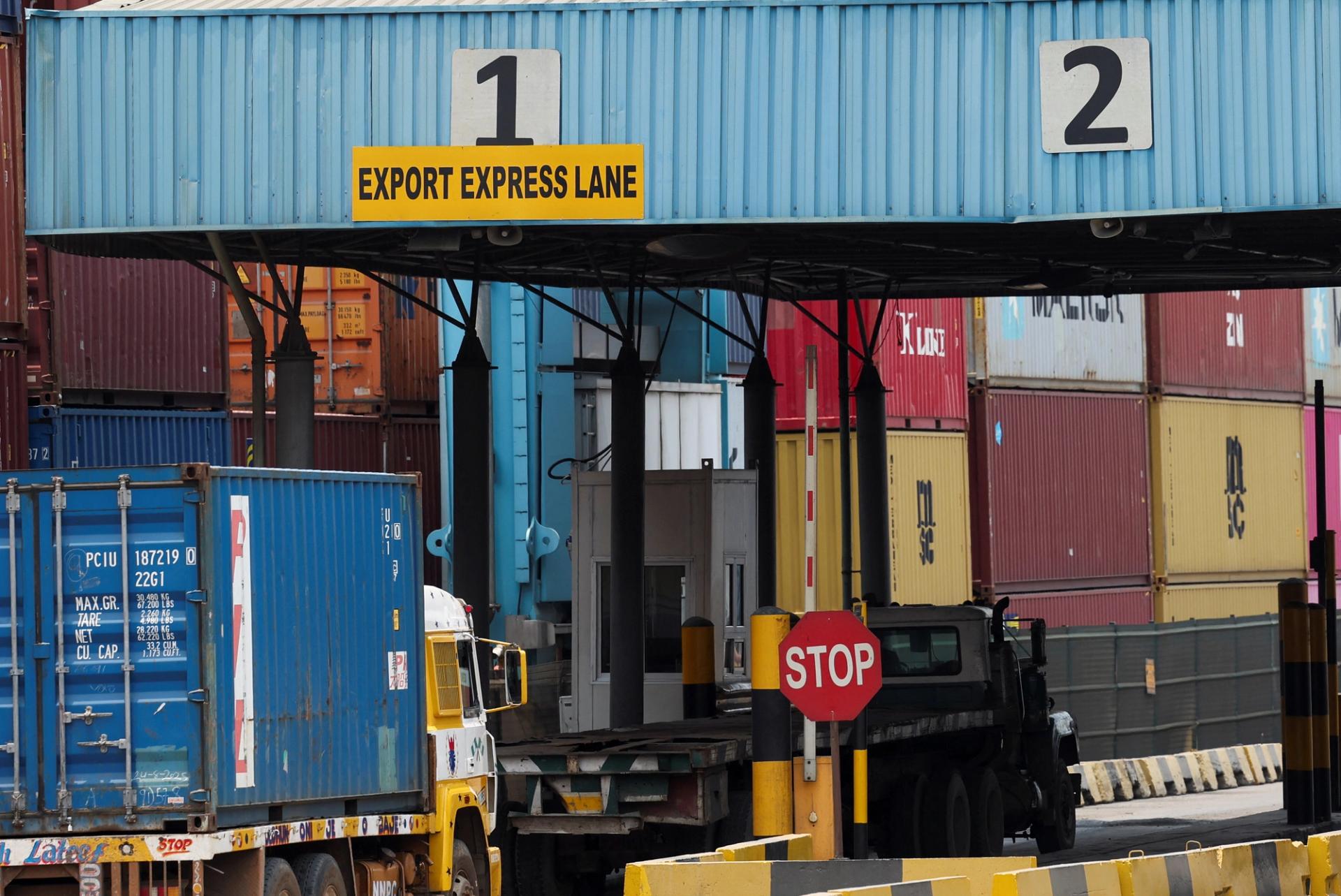 A truck transports a shipping container