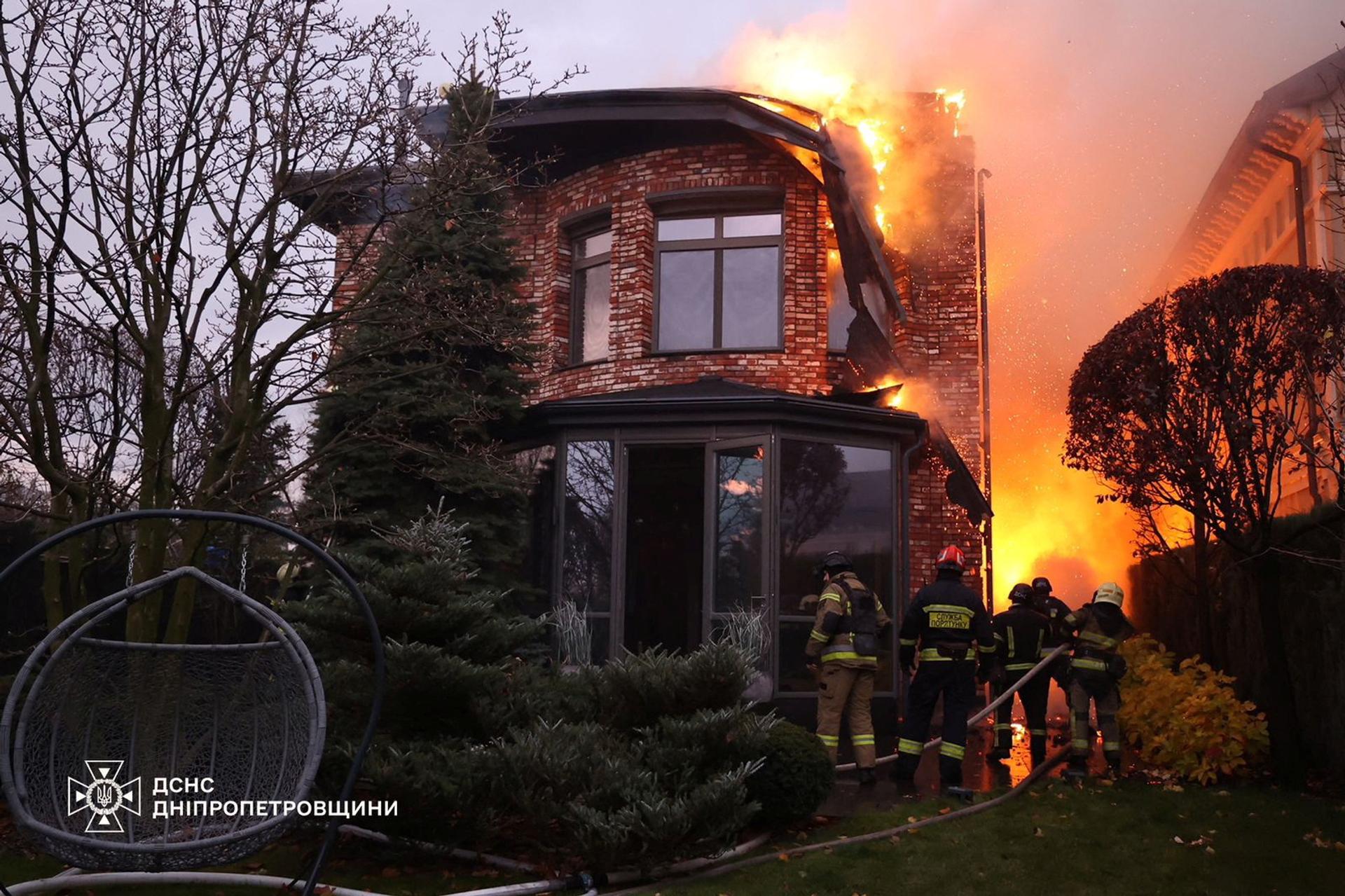 Firefighters work at the site of a Russian missile strike, amid Russia’s attack on Ukraine, in Dnipro, Ukraine November 21, 2024.