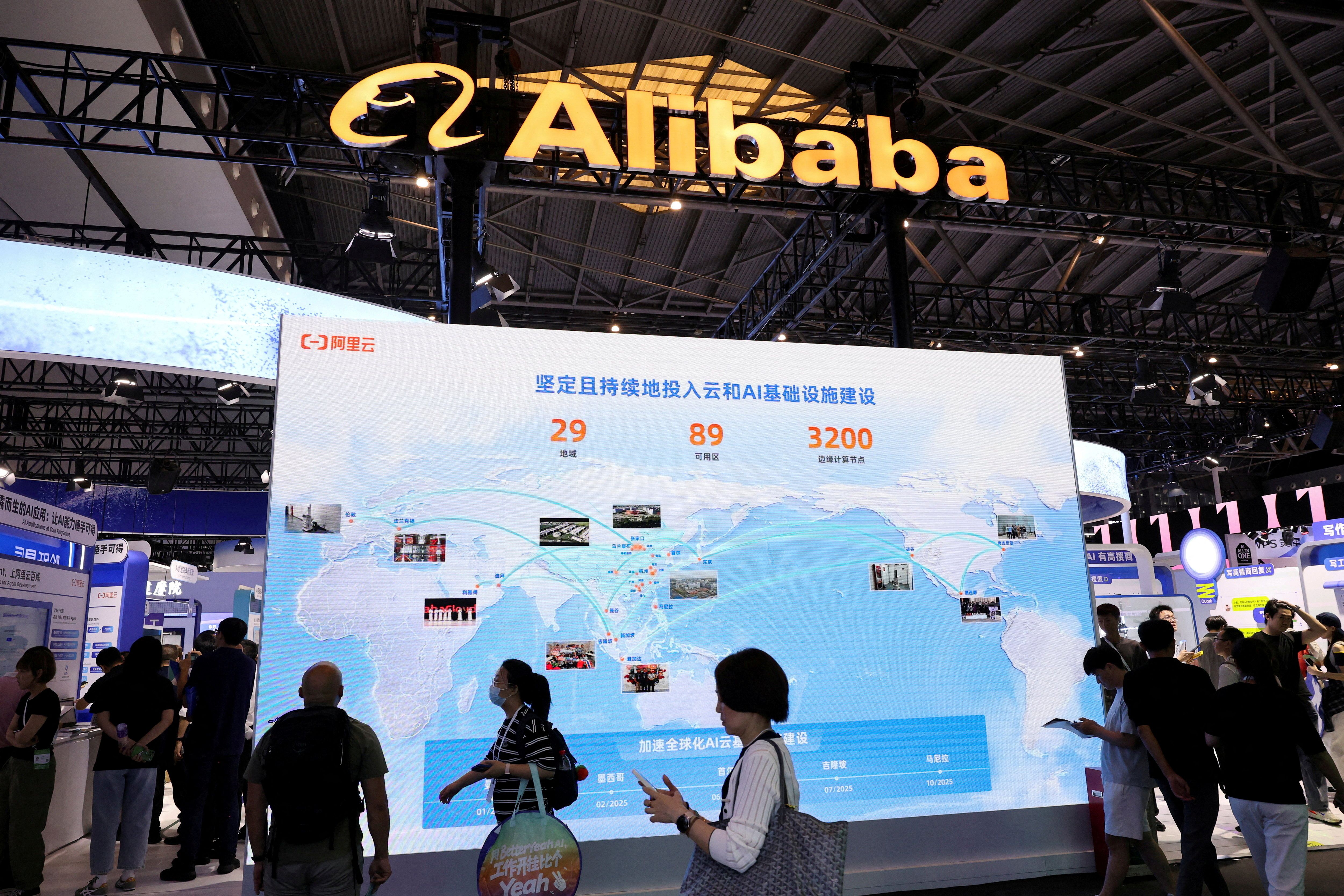 People at an Alibaba booth at the World Artificial Intelligence Conference in Shanghai, China in 2025