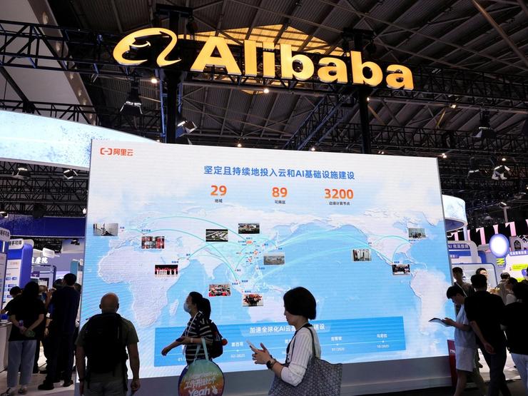 People at an Alibaba booth at the World Artificial Intelligence Conference in Shanghai, China in 2025