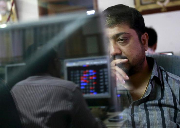 A broker at a stock brokerage firm in Mumbai, India.