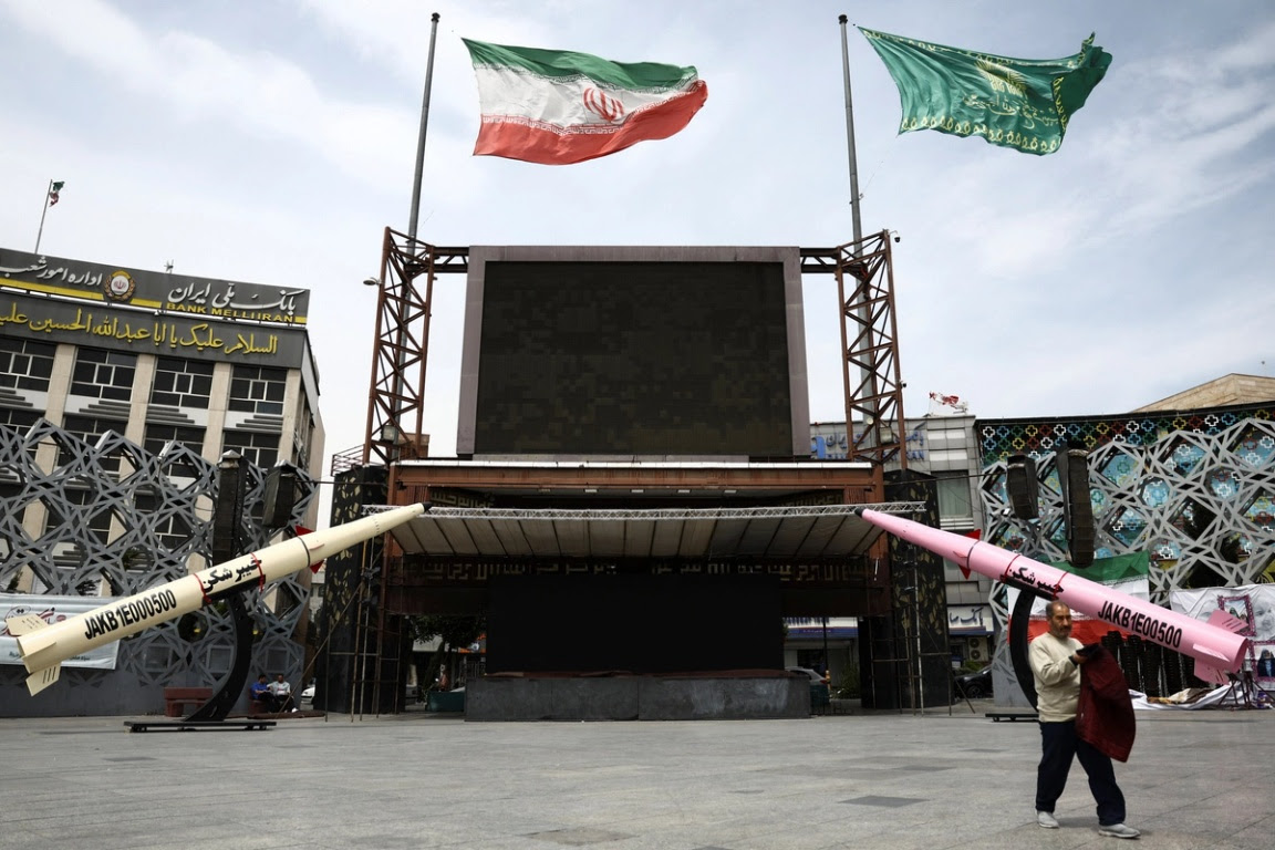 Missiles and an Iranian flag.