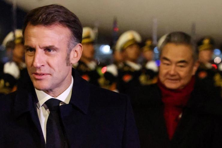 Macron and Wang Yi in China.