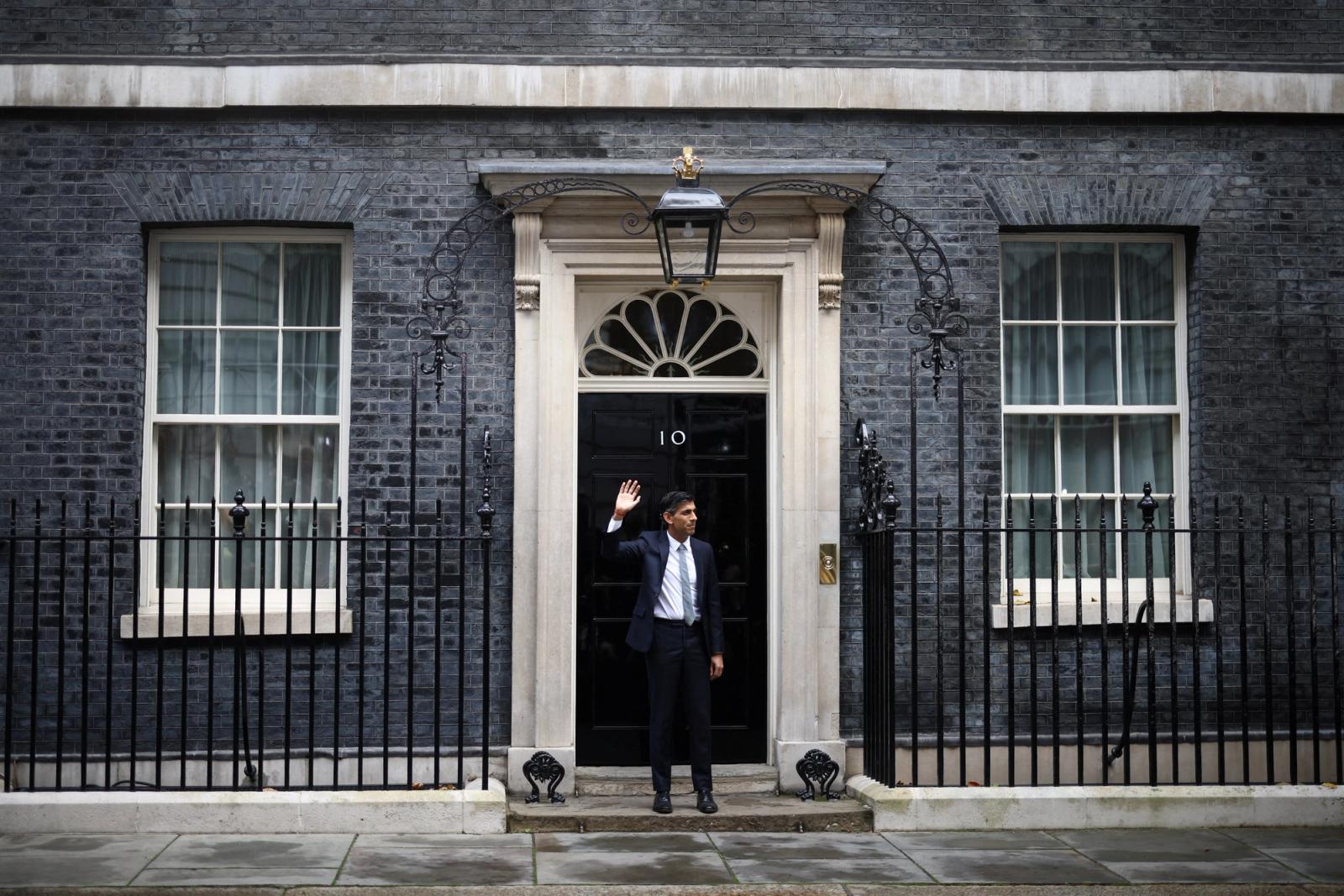 Britain's new Prime Minister Rishi Sunak waves as he enters Number 10 Downing Street, in London, Britain, October 25, 2022.