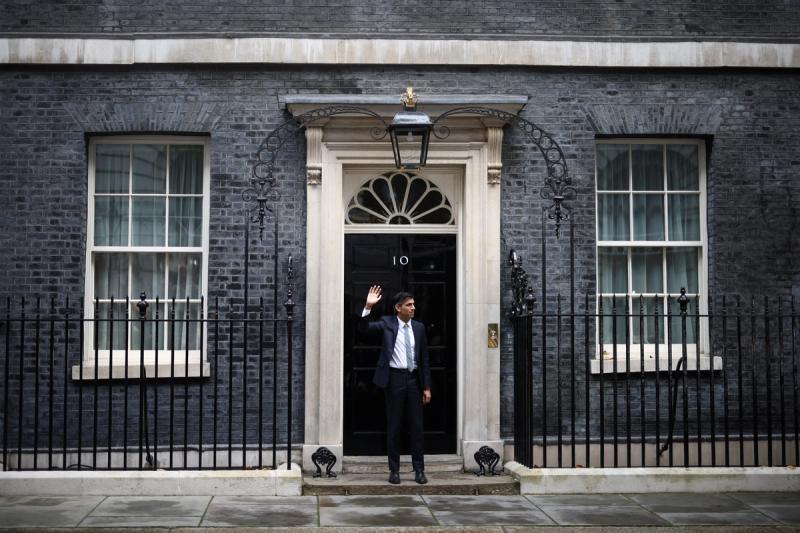 Britain’s new Prime Minister Rishi Sunak waves as he enters Number 10 Downing Street, in London, Britain, October 25, 2022.