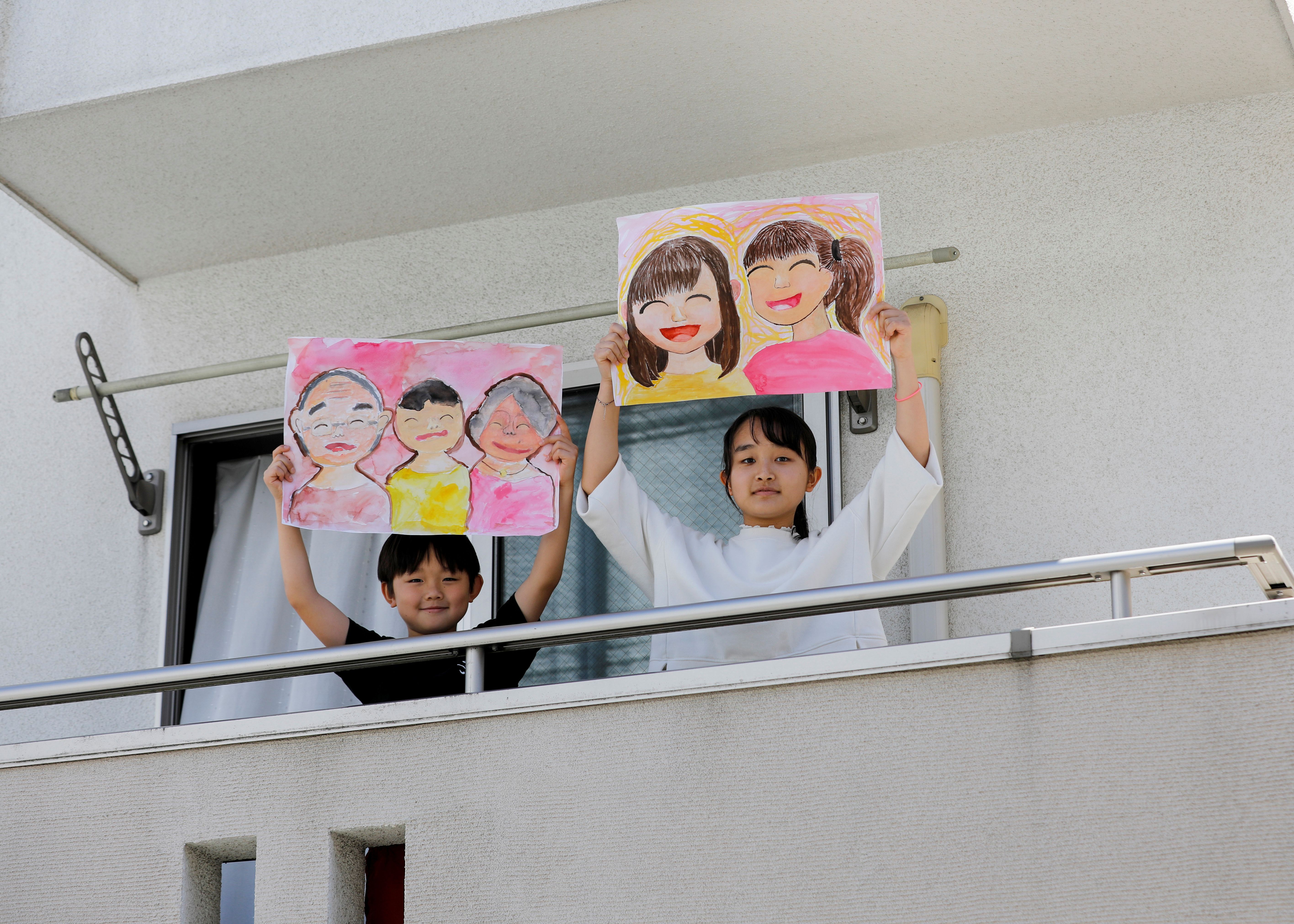 Children with drawings of their friends