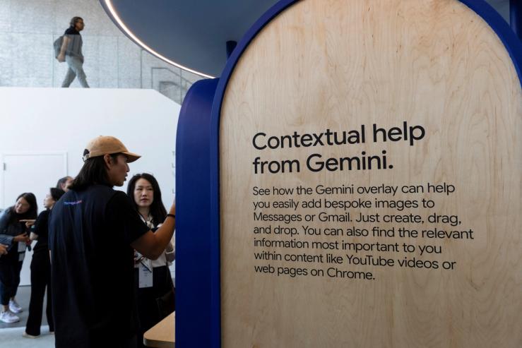 Attendants try the new Gemini AI model features at a Made by Google event in Mountain View