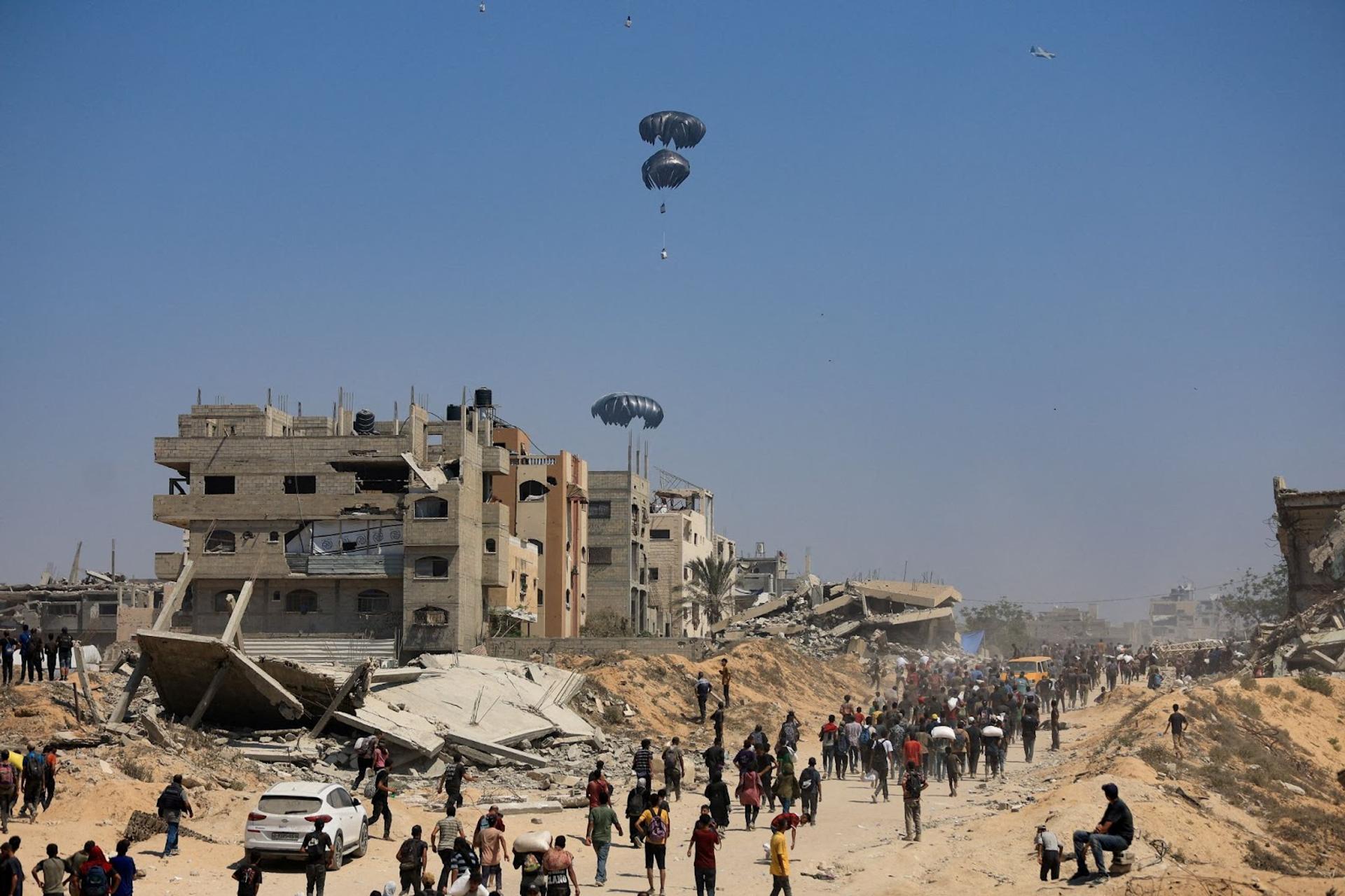 Humanitarian aid is airdropped over Gaza as seen from northern Gaza Strip July 27.
